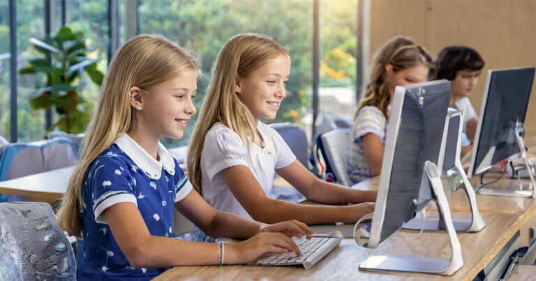 5th grade students working at computers