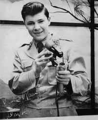 Young actor Don Hastings in costume holding a small prop device during his early television years on Captain Video and His Video Rangers.