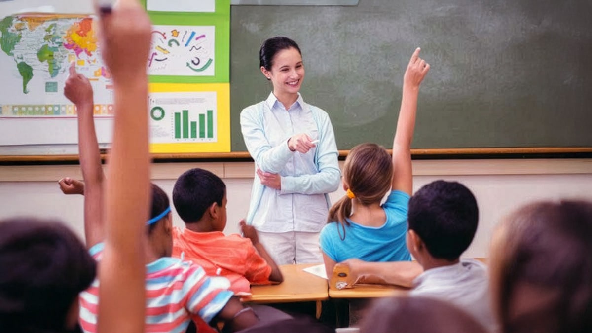 Some students raising their hands to answer teacher
