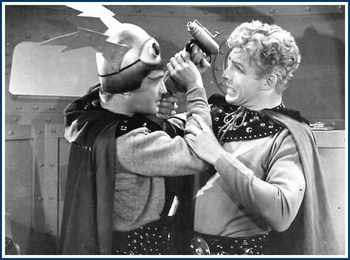 Buster Crabbe as Buck Rogers confronts Anthony Warde as Killer Kane in the 1939 Buck Rogers serial alongside Jackie Moran